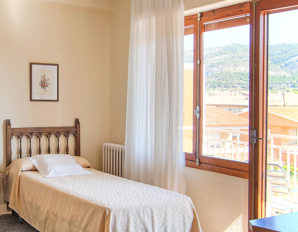 Single Room Partial view of the room, with access to a balcony overlooking the city and mountains