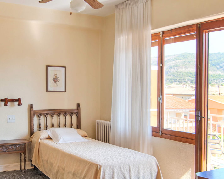 Single Room_Balcony Partial view of the room, with access to a balcony overlooking the city and mountains