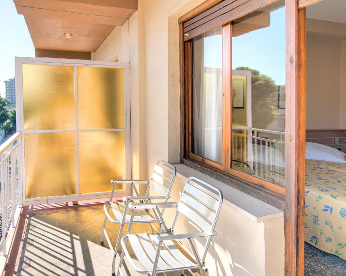 Triple Room_Balcony Room balcony with two chairs