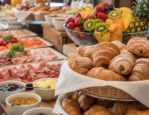 Breakfast Buffet with fruit, cold meats and pastries
